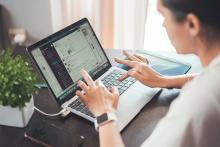 Woman doing research on a laptop